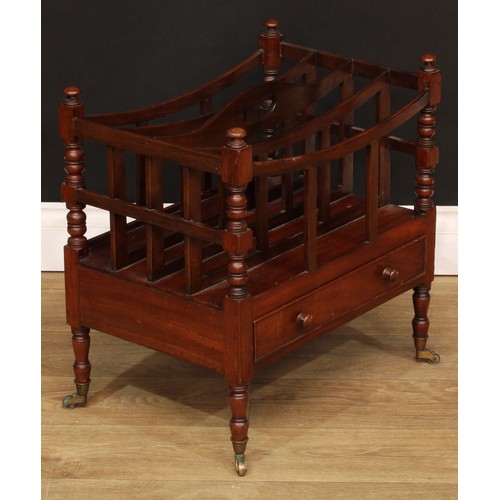 1807 - A Victorian mahogany four-section Canterbury, bowed divisions, pierced carry handle, turned supports... 