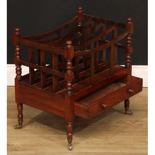 1807 - A Victorian mahogany four-section Canterbury, bowed divisions, pierced carry handle, turned supports... 