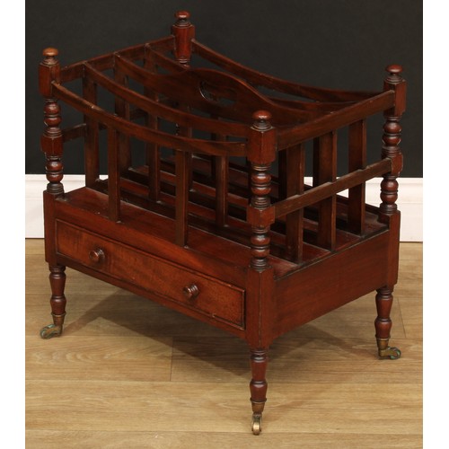 1807 - A Victorian mahogany four-section Canterbury, bowed divisions, pierced carry handle, turned supports... 