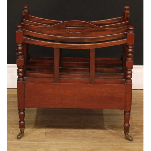 1807 - A Victorian mahogany four-section Canterbury, bowed divisions, pierced carry handle, turned supports... 