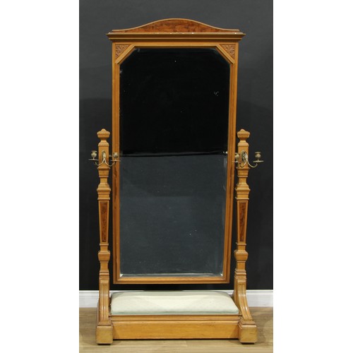 1815 - A Victorian ash and walnut cheval mirror, by Gillows of Lancaster, stamped, arched cresting above a ... 