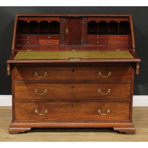 1816 - A George III mahogany bureau, fall front enclosing a writing surface, a door, small drawers, pigeonh... 