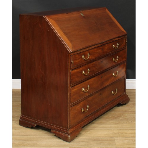 1816 - A George III mahogany bureau, fall front enclosing a writing surface, a door, small drawers, pigeonh... 