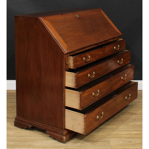 1816 - A George III mahogany bureau, fall front enclosing a writing surface, a door, small drawers, pigeonh... 