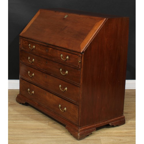 1816 - A George III mahogany bureau, fall front enclosing a writing surface, a door, small drawers, pigeonh... 