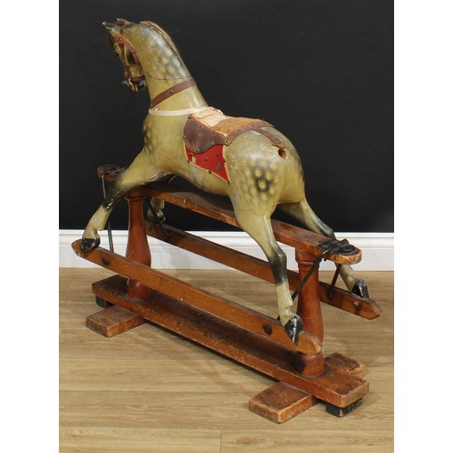 3236 - A late 19th/early 20th century English rocking horse of small proportions on safety stand, probably ... 