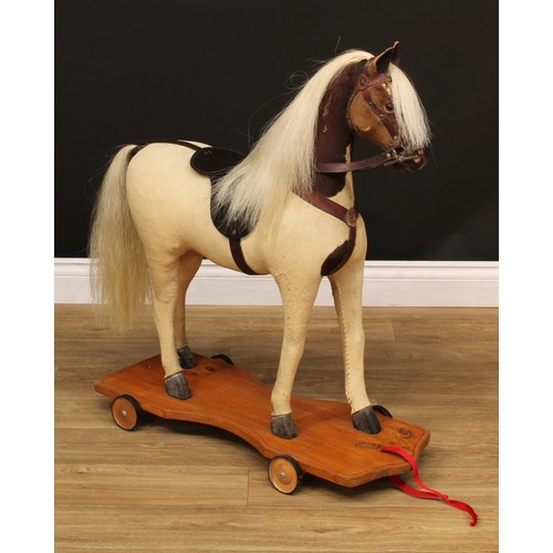 3237 - A late 19th/early 20th century horse on wheels, probably produced in the German or Swiss region, the... 