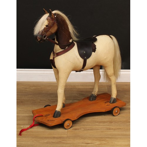 3237 - A late 19th/early 20th century horse on wheels, probably produced in the German or Swiss region, the... 