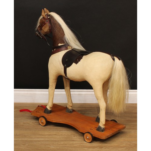 3237 - A late 19th/early 20th century horse on wheels, probably produced in the German or Swiss region, the... 