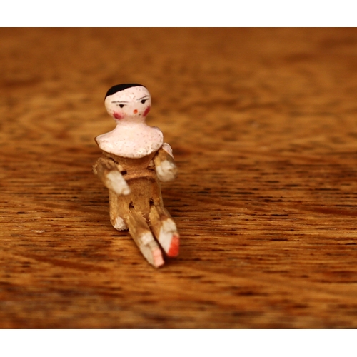 3297 - An early 20th century novelty miniature wooden jointed peg doll/Dutch doll or Grödner Gliederpuppen,... 