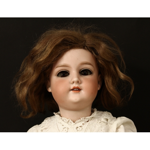 3299 - An Armand & Marseille (Germany) bisque head and ball jointed composition bodied doll, weighted sleep... 