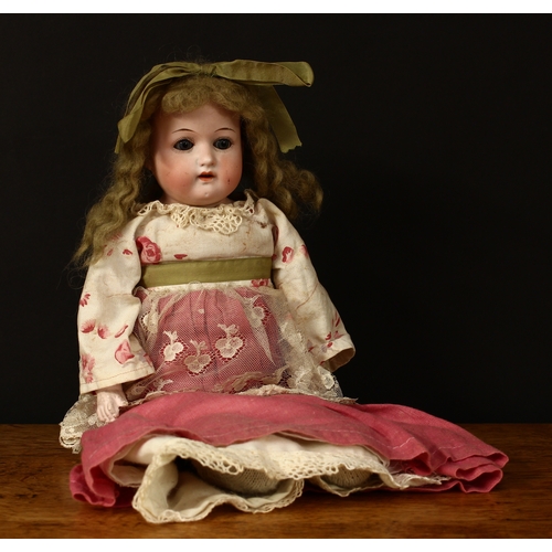 3300 - A Heubach Koppelsdorf (Germany) bisque shoulder head and partially stuffed cloth bodied doll, weight... 