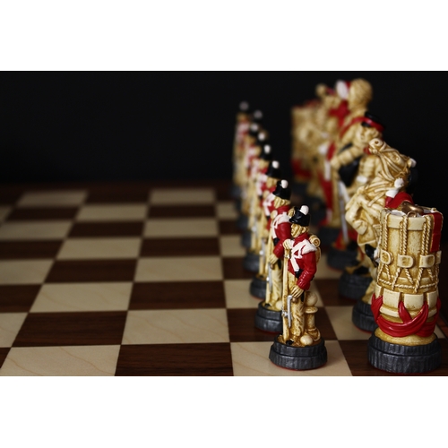 3350 - A Studio Anne Carlton Battle of Waterloo chess set, boxed with literature and a chess board, boxed (... 