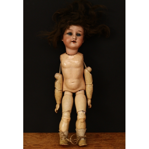 3302 - An Armand & Marseille (Germany) bisque head and fixed ball jointed composition bodied doll, weighted... 