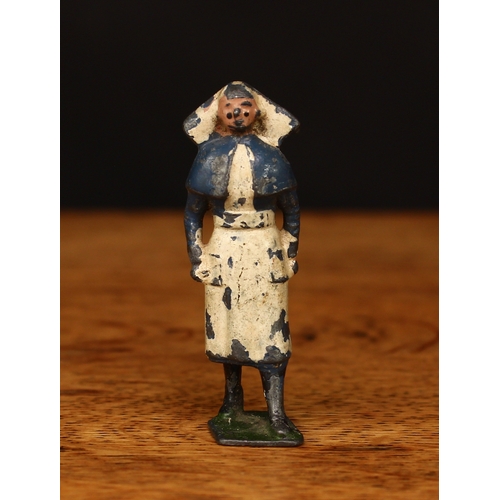 3361 - W Britain (Britains) unlisted second-grade Nurse figure, blue cape and dress, shaped rectangular bas... 