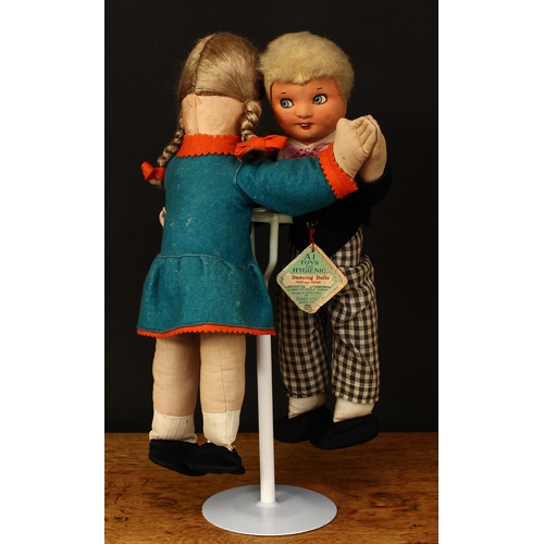 3304 - A pair of 1930's Dean's Rag Book Co. Joan and Peter felt and cloth novelty dancing dolls, moulded cl... 