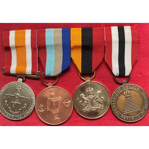 2255 - Mixed Militaria to include: Set of four Nigerian Medals mounted on a bar, South Wales Borderers and ... 