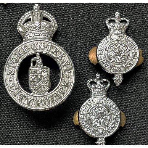 2283 - A collection of Queens Crown Police Helmet Plates and cap badges and one Kings Crown Stoke on Trent ... 