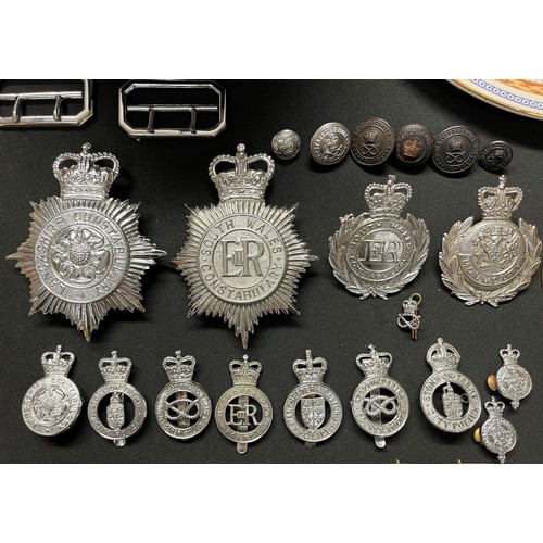 2283 - A collection of Queens Crown Police Helmet Plates and cap badges and one Kings Crown Stoke on Trent ... 