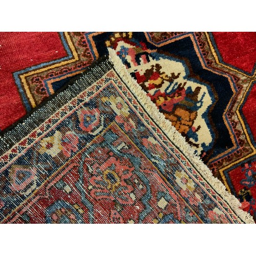 88 - A Persian hand-made Bakhtiar Golfarang rug, the central field with an arrangement of six star-shaped... 