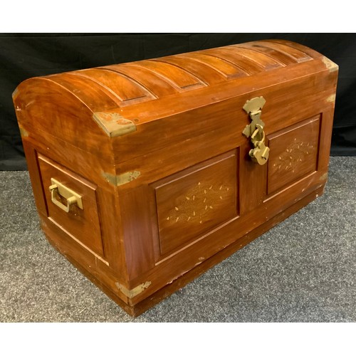 283 - A 20th century teak, domed-top trunk, brass inlay with foliate scrolls, the interior with lift-out t... 