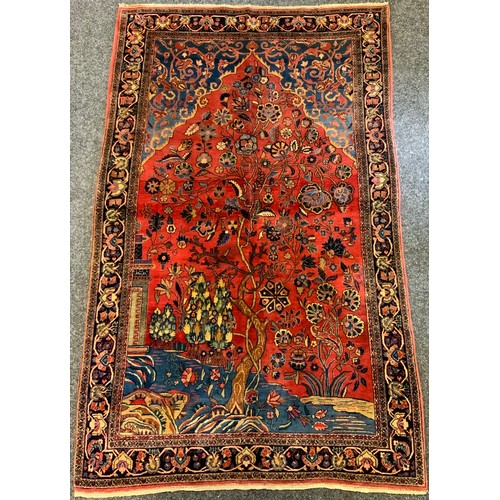 285 - A Persian Farahan hand-knotted rug, the central field woven with a scene depicting Trees and temple ... 