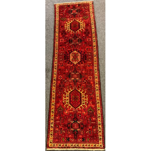 287 - A Heriz runner, approx 295cm x 90cm