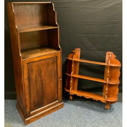 380 - A mid 20th century oak waterfall bookcase cupboard, 139cm tall x 50cm wide x 34cm depth, c.1950;  a ... 