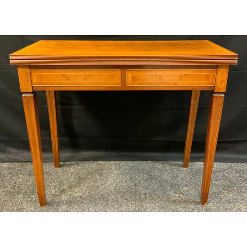 381 - A reproduction yew wood veneer card table, rectangular top, tapering square legs, boxwood stringing ... 