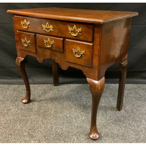 394 - A George III style mahogany lowboy, over sailing top above one long and three short frieze drawers, ... 