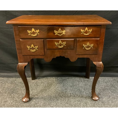 394 - A George III style mahogany lowboy, over sailing top above one long and three short frieze drawers, ... 