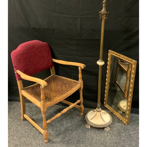 395 - A neoclassical gilt metal and Alabaster standard lamp;  rattan arm chair;  gilt framed rectangular m... 