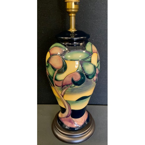 399 - A Moorcroft Western Isles pattern inverted baluster table lamp, designed by Sian Leaper, wooden base... 