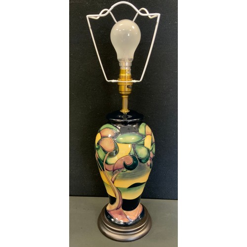 399 - A Moorcroft Western Isles pattern inverted baluster table lamp, designed by Sian Leaper, wooden base... 