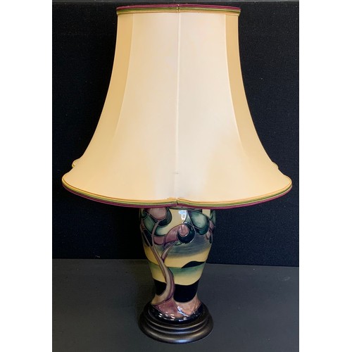 399 - A Moorcroft Western Isles pattern inverted baluster table lamp, designed by Sian Leaper, wooden base... 