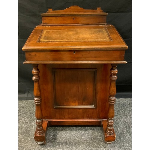 403 - A late Victorian Mahogany Davenport, sloped writing surface, fitted interior, four side drawers, tur... 