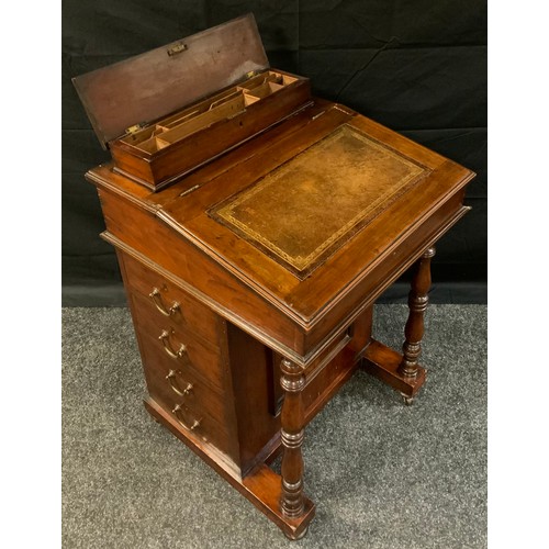 403 - A late Victorian Mahogany Davenport, sloped writing surface, fitted interior, four side drawers, tur... 