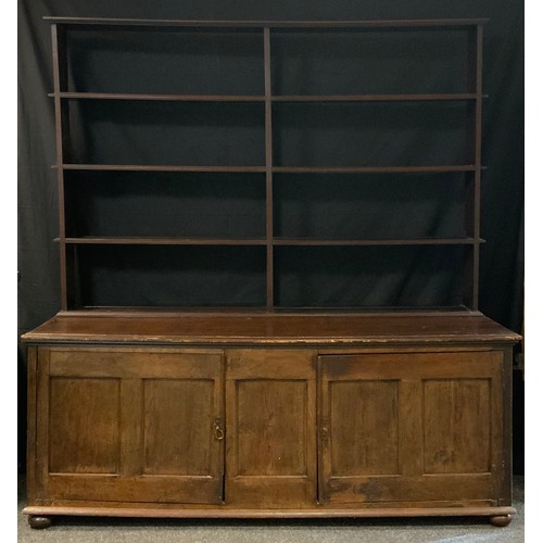 396 - A 19th century oak sideboard, plank top, two cupboard doors, panelled sides, 76cm high, 195cm wide, ... 