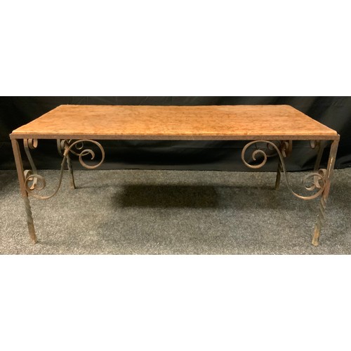 401 - A wrought iron marble topped rectangular coffee table, veined peach top, scrolled spiralled legs, 43... 