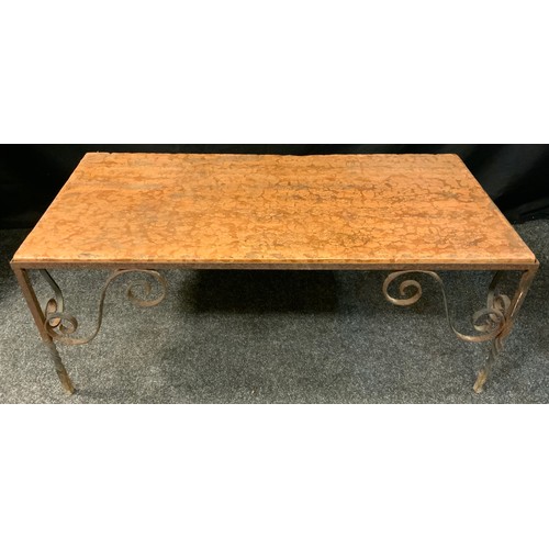 401 - A wrought iron marble topped rectangular coffee table, veined peach top, scrolled spiralled legs, 43... 