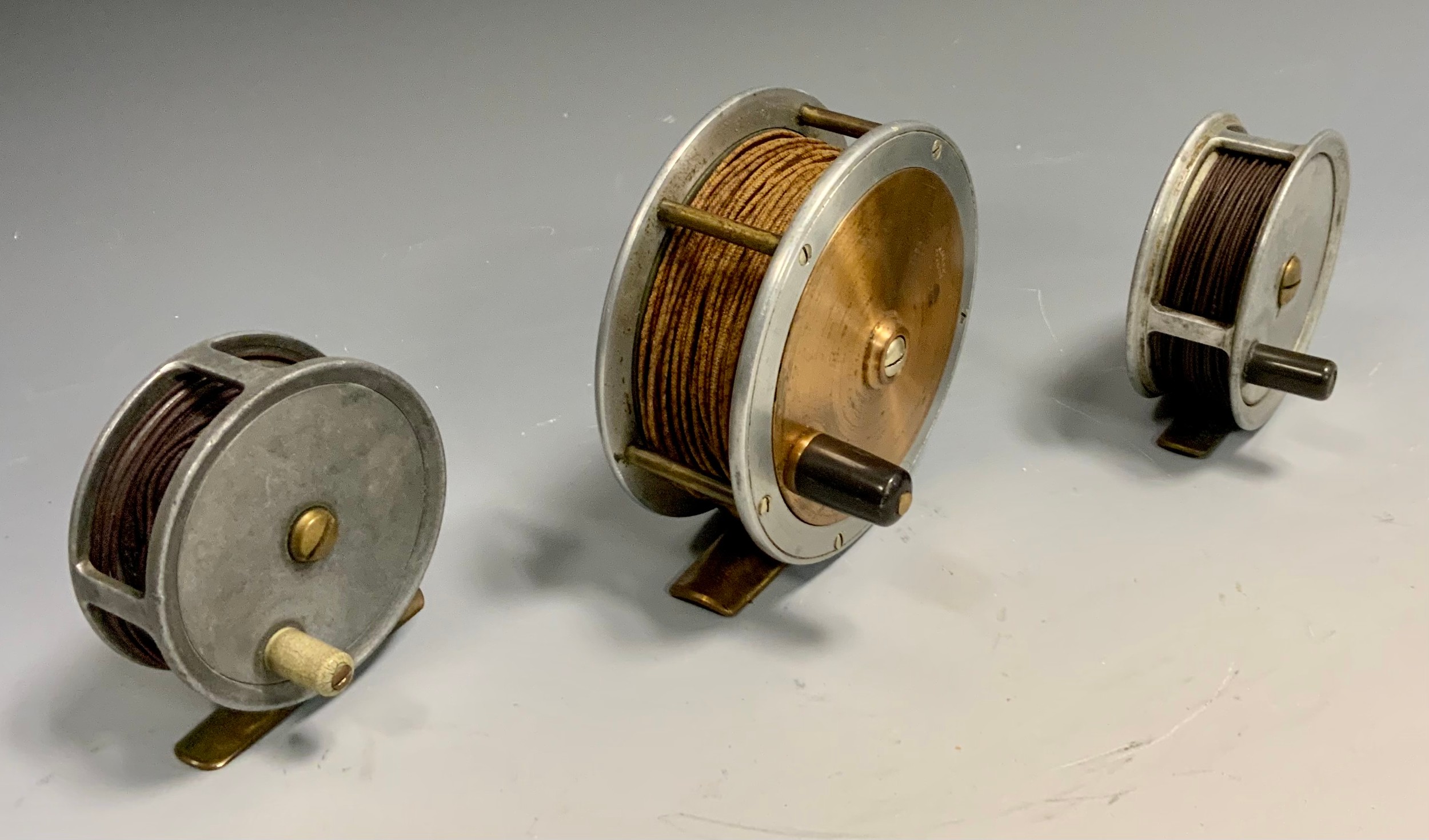 Fishing Reels - a large A Allan of Glasgow two tone fly fishing reel,10cm  diameter; others smaller A