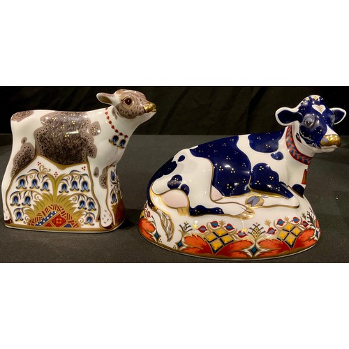 54 - A Royal Crown Derby paperweight, Friesian Cow Buttercup, gold stopper, boxed; another Bluebell Calf,... 