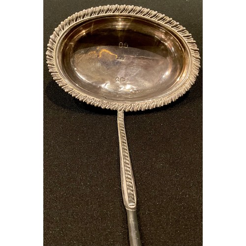 175 - A George III silver punch ladle, gadrooned borders,  twisted baleen handle, 36cm long, William Knigh... 