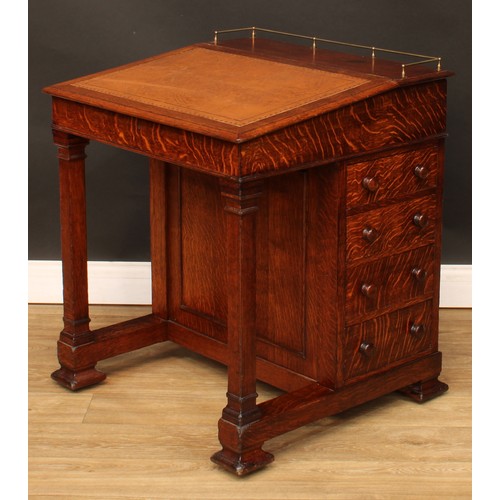 6 - An Arts & Crafts period oak Davenport desk, hinged sloping top with inset tooled writing surface enc... 