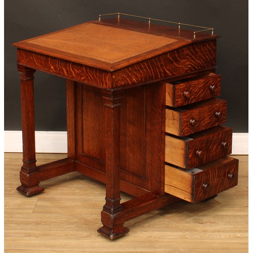 6 - An Arts & Crafts period oak Davenport desk, hinged sloping top with inset tooled writing surface enc... 