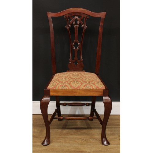 9 - A set of eight Chippendale design dining chairs, comprising six side chairs and a pair of carvers, t... 