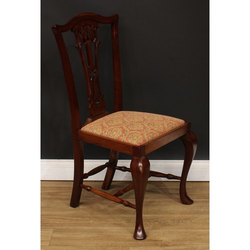 9 - A set of eight Chippendale design dining chairs, comprising six side chairs and a pair of carvers, t... 