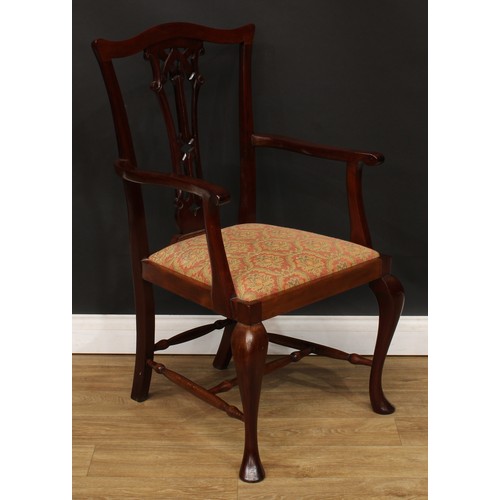 9 - A set of eight Chippendale design dining chairs, comprising six side chairs and a pair of carvers, t... 