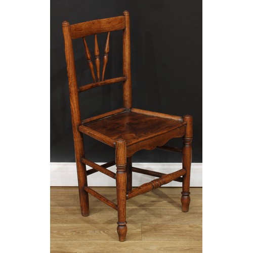 19 - A 19th century child’s Windsor rocking chair, 65.5cm high, 38cm wide, the seat 28cm wide and 23cm de... 