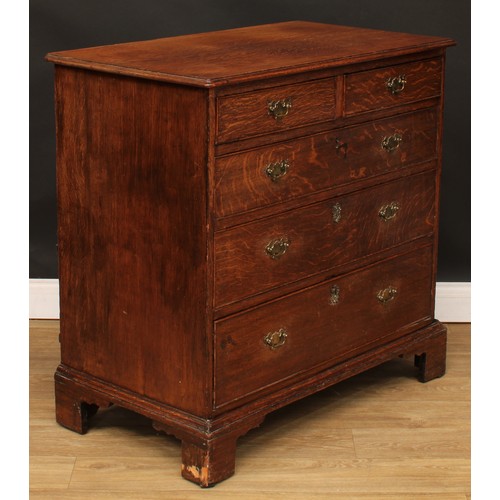 102 - A George III oak chest, slightly oversailing top above two short and three long graduated cockbeaded... 